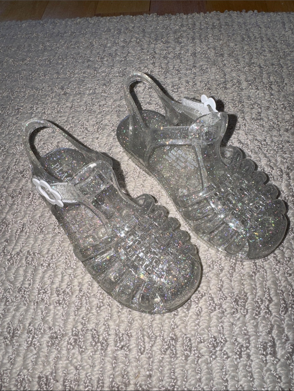 Children’s place Clear Glitter Jelly Sandals with White Flower Buckle